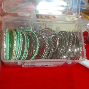 6  bangle bracelets silver ,gold, and mint green.